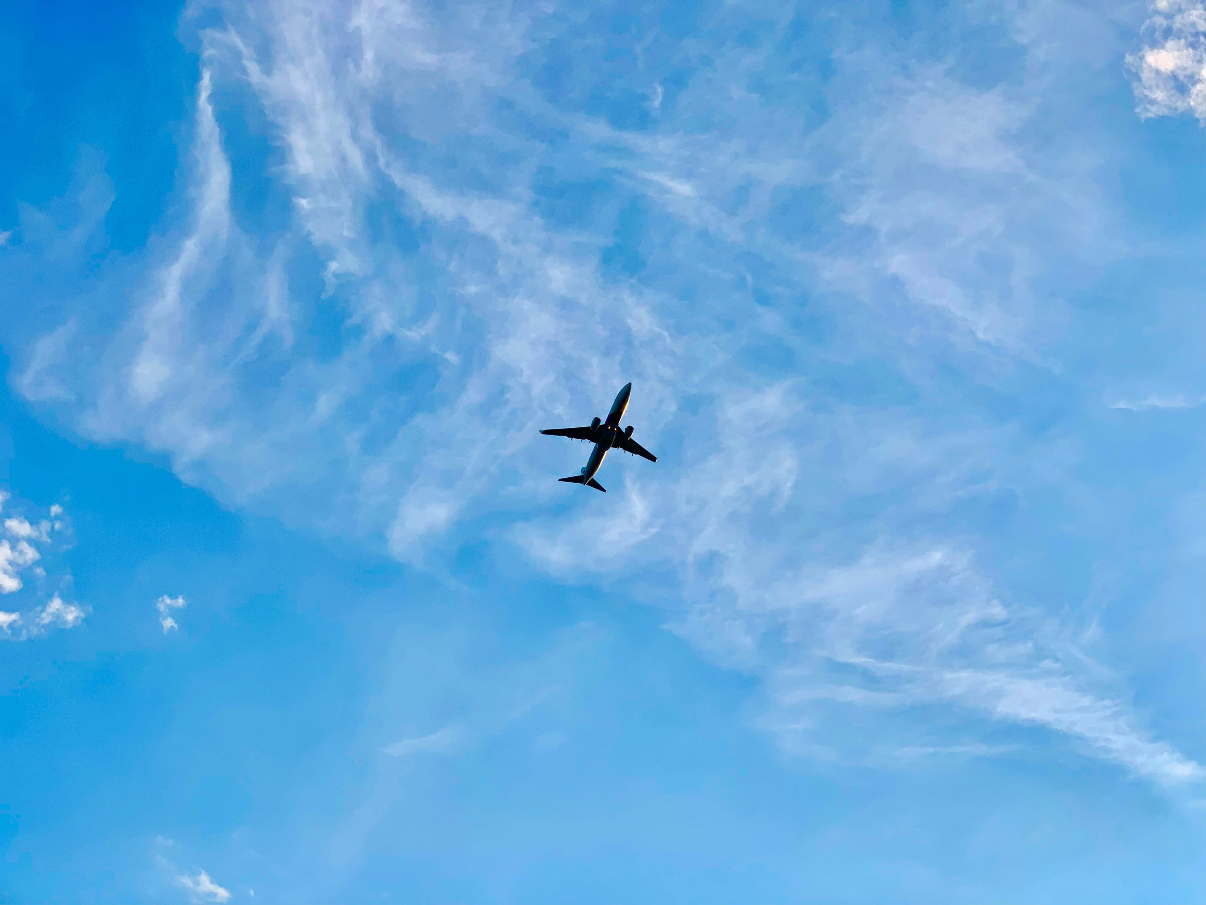 Courier plane in a cloudy sky